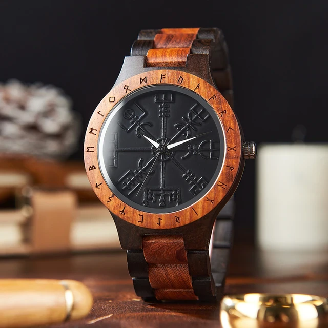 Wooden Norse Viking Design Watch. A unique style of watch with the strap, front and back of the watch all made from highly polished wood. Each time piece comes in a wooden display box and makes a perfect gift for fans of Norse Mythology and Viking Style. Complete with the Vegvisir Viking wayfinder on the watch face giving a unique and stylish look. Each watch also comes with a tool to help you add and remove links and a care &amp; instruction manual.