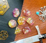 Chaos Fairy Polyhedral Dice Set  Roll to the gods with these pink and gold shimmer resin polyhedral dice set.  They are standard 16mm polyhedral dice sets perfect for Tabletop games and RPG's such as pathfinder or dungeons and dragons.  This set includes one of each D20, D12, D10, D%, D8, D6, D4.