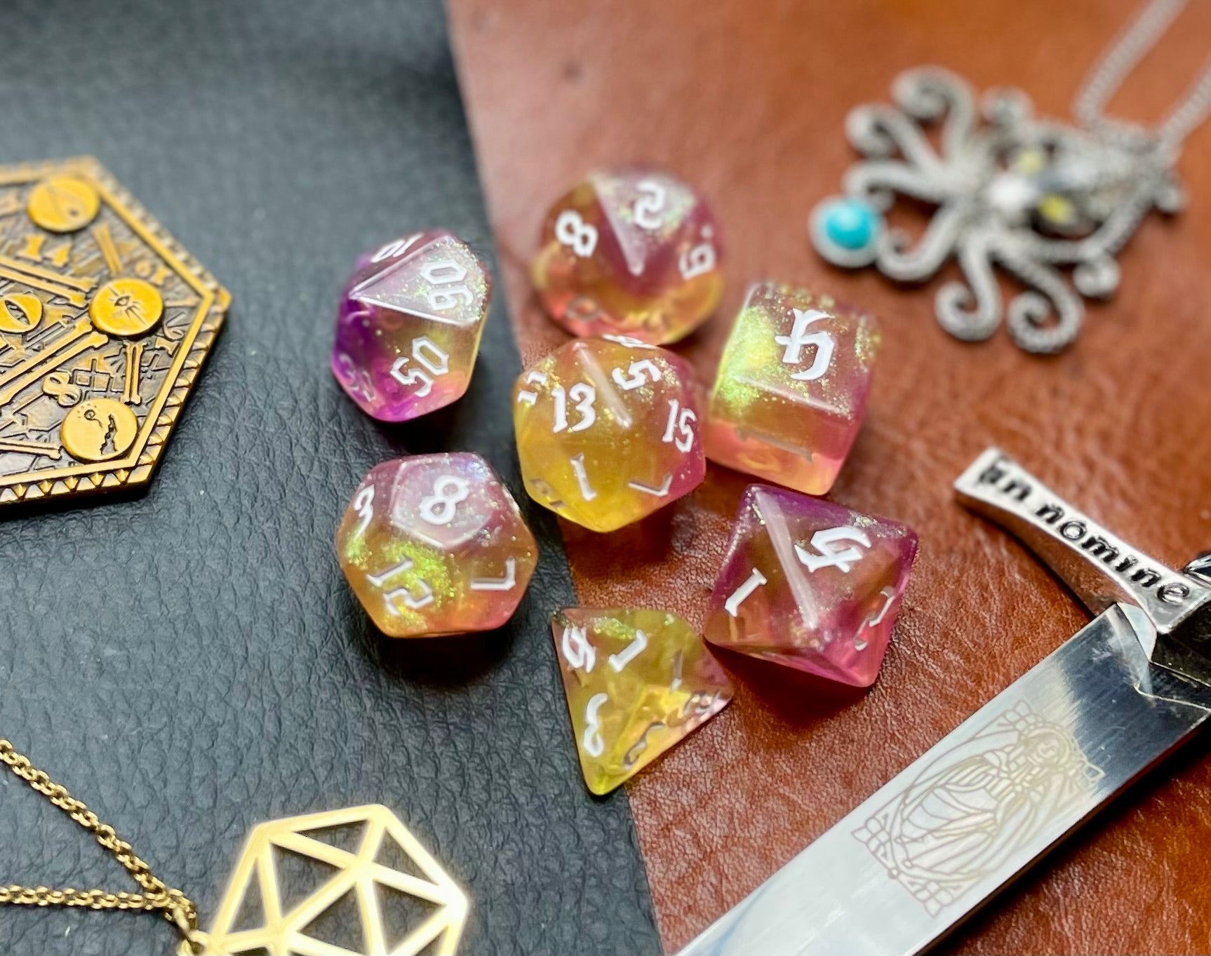 Chaos Fairy Polyhedral Dice Set  Roll to the gods with these pink and gold shimmer resin polyhedral dice set.  They are standard 16mm polyhedral dice sets perfect for Tabletop games and RPG's such as pathfinder or dungeons and dragons.  This set includes one of each D20, D12, D10, D%, D8, D6, D4.