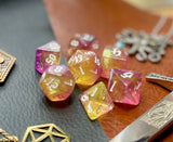 Chaos Fairy Polyhedral Dice Set  Roll to the gods with these pink and gold shimmer resin polyhedral dice set.  They are standard 16mm polyhedral dice sets perfect for Tabletop games and RPG's such as pathfinder or dungeons and dragons.  This set includes one of each D20, D12, D10, D%, D8, D6, D4.