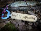 "Tool Of Opening" Wooden Bottle Opener  Engraved wooden handles bottle opener with "Tool of Opening" design. A perfect gift for any RPG or DND fan. Made from solid beech, stainless steel opener and engraved to order; these make a perfect quirky drinking gift.