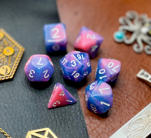 Miami Vice Polyhedral Dice Set  Miami Vice... or should that be dice? These vivid blue and pink swirl resin polyhedral dice sets are a perfect addition to any dice collection.  They are standard 16mm polyhedral dice sets perfect for Tabletop games and RPG's such as pathfinder or dungeons and dragons.  This set includes one of each D20, D12, D10, D%, D8, D6, D4.