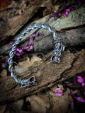 Viking style solid stainless steel bangle. Release your inner viking with this dragon head bangle with twist design. With a solid feel and detailed finish; these bangles a built for true modern day vikings.