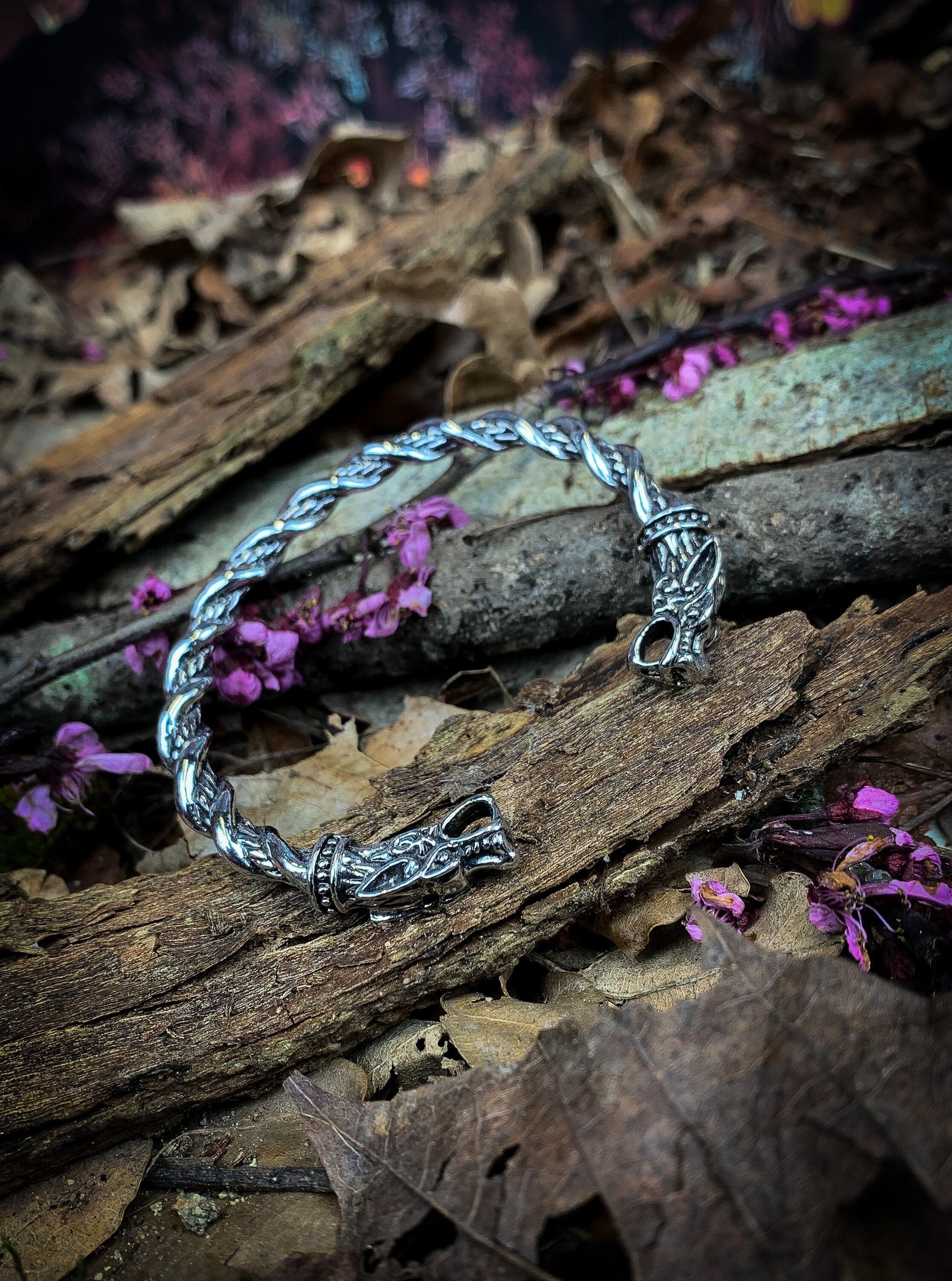 Viking style solid stainless steel bangle. Release your inner viking with this dragon head bangle with twist design. With a solid feel and detailed finish; these bangles a built for true modern day vikings.