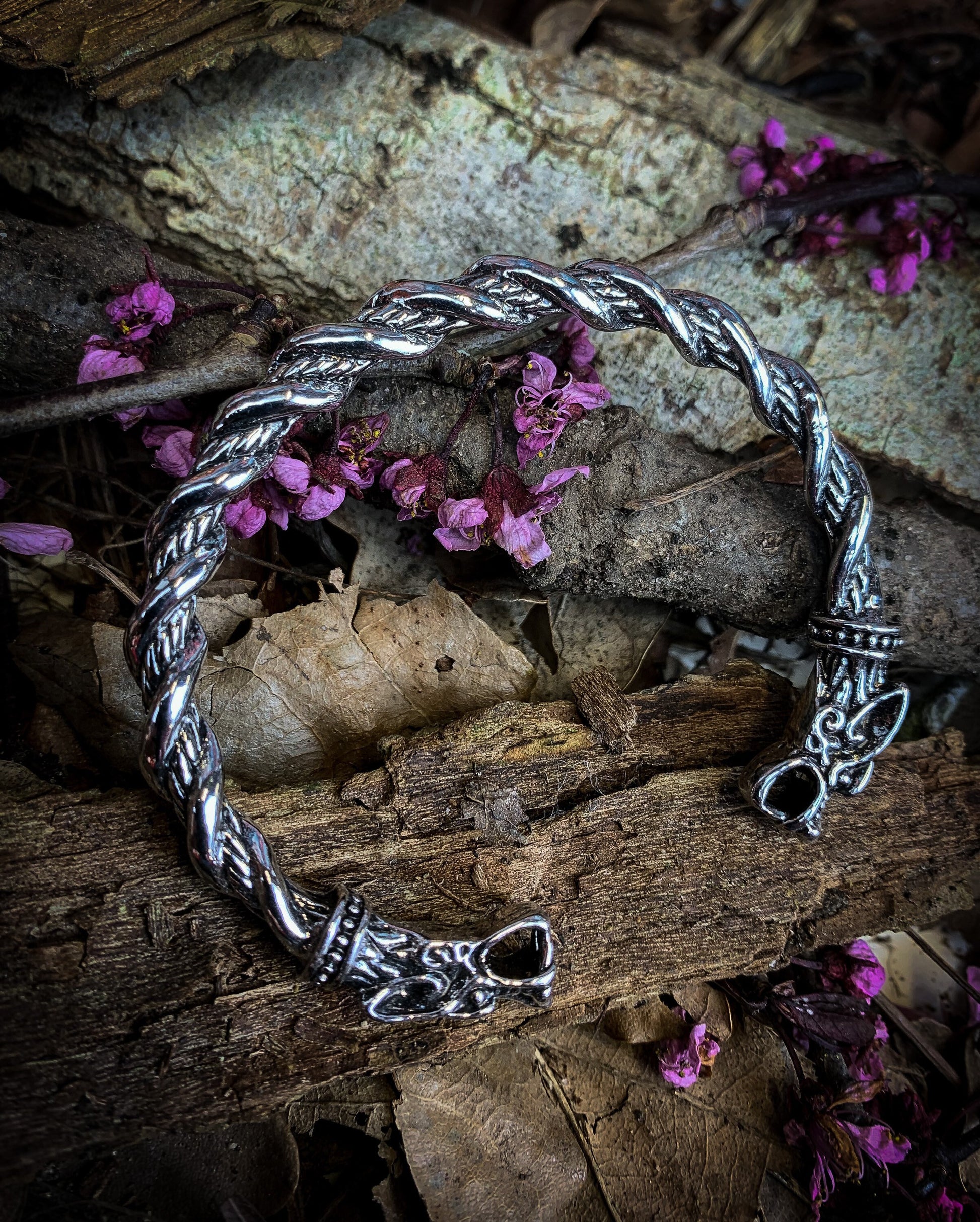 Viking style solid stainless steel bangle. Release your inner viking with this dragon head bangle with twist design. With a solid feel and detailed finish; these bangles a built for true modern day vikings.