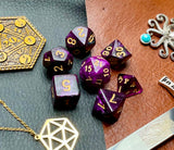 Purple Galaxy Polyhedral Dice Set  Travel the galaxy with these purple shimmer resin polyhedral dice sets are a perfect addition to any dice collection.  They are standard 16mm polyhedral dice sets perfect for Tabletop games and RPG's such as pathfinder or dungeons and dragons.  This set includes one of each D20, D12, D10, D%, D8, D6, D4.