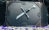 Behold the screen of shattered blades dungeon master screen. Made from solid wood with a black PU leather front; this screen is made to create atmosphere at your table. Complete with 3D sword hilt on the center panel - a reminder to your players of those who have fallen before your dice!  Free UK shipping from Fandomonium