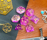 Storm Nebula Polyhedral Dice Set  Enter the storm nebula with these translucent purple and clear swirl resin polyhedral dice sets are a perfect addition to any dice collection.  They are standard 16mm polyhedral dice sets perfect for Tabletop games and RPG's such as pathfinder or dungeons and dragons.  This set includes one of each D20, D12, D10, D%, D8, D6, D4.
