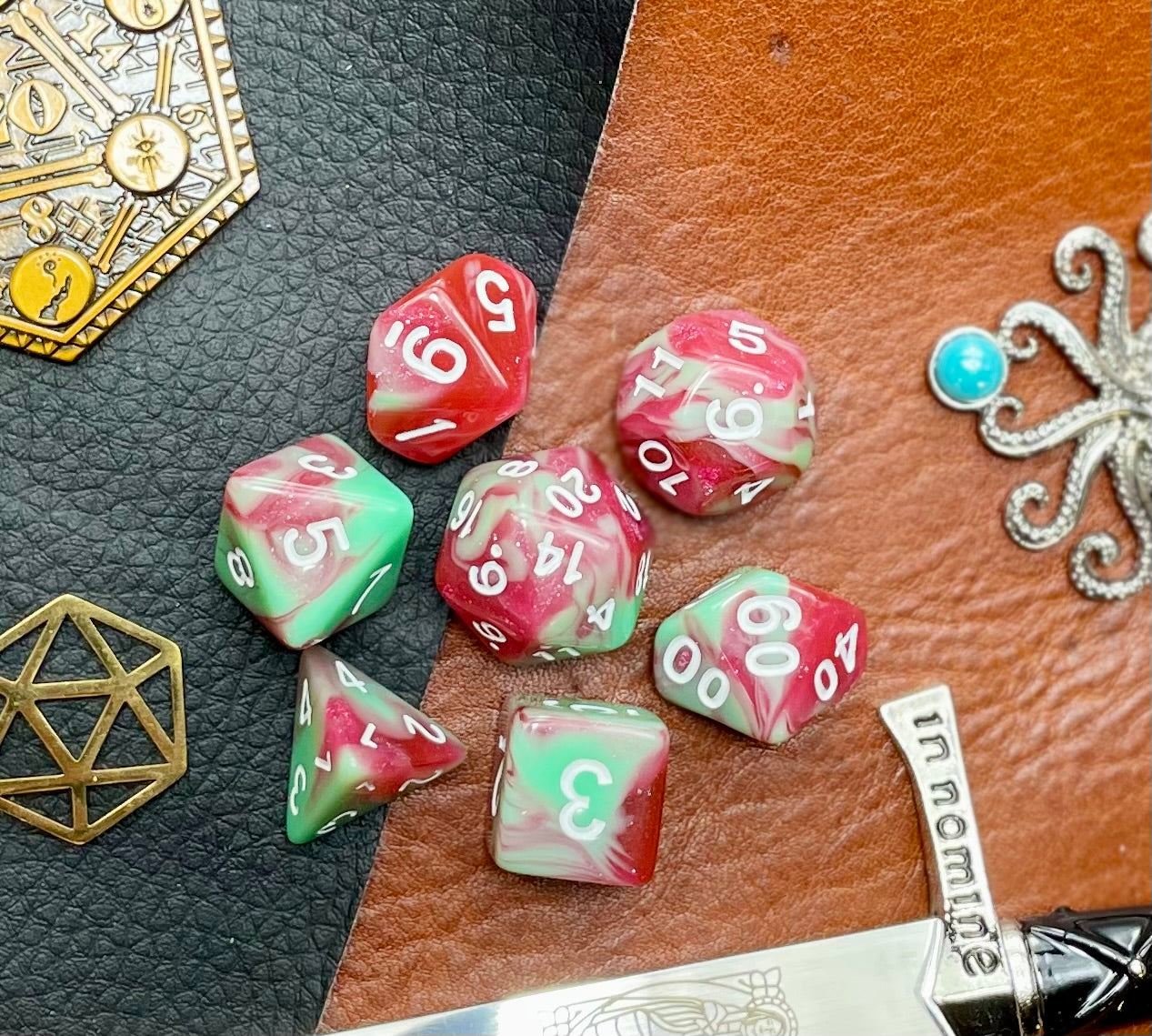 Strawberry Cream Polyhedral Dice Set  Almost good enough to eat! These red and green swirl resin polyhedral dice sets are a perfect addition to any dice collection.  They are standard 16mm polyhedral dice sets perfect for Tabletop games and RPG's such as pathfinder or dungeons and dragons.  This set includes one of each D20, D12, D10, D%, D8, D6, D4.