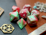 Strawberry Cream Polyhedral Dice Set  Almost good enough to eat! These red and green swirl resin polyhedral dice sets are a perfect addition to any dice collection.  They are standard 16mm polyhedral dice sets perfect for Tabletop games and RPG's such as pathfinder or dungeons and dragons.  This set includes one of each D20, D12, D10, D%, D8, D6, D4.