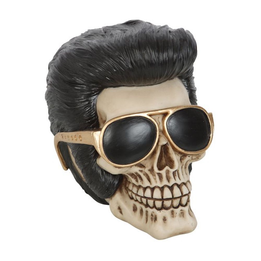 This realistic resin skull ornament wears a pompadour hairstyle and flashy gold sunglasses reminiscent of the King of Rock and Roll. Highly detailed with hand painted details, this eye-catching figurine will be a welcome addition to any skull or Elvis collection. Free UK Delivery by Fandomonium