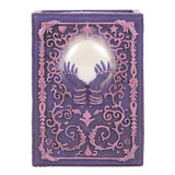 Mystical Crystal Ball Resin Storage Box  A resin box with raised filigree details and a mystical hand and crystal ball design in the center. This pink and purple style is perfect for holding small tarot card decks, crystals, herbs and other small objects for safe keeping.