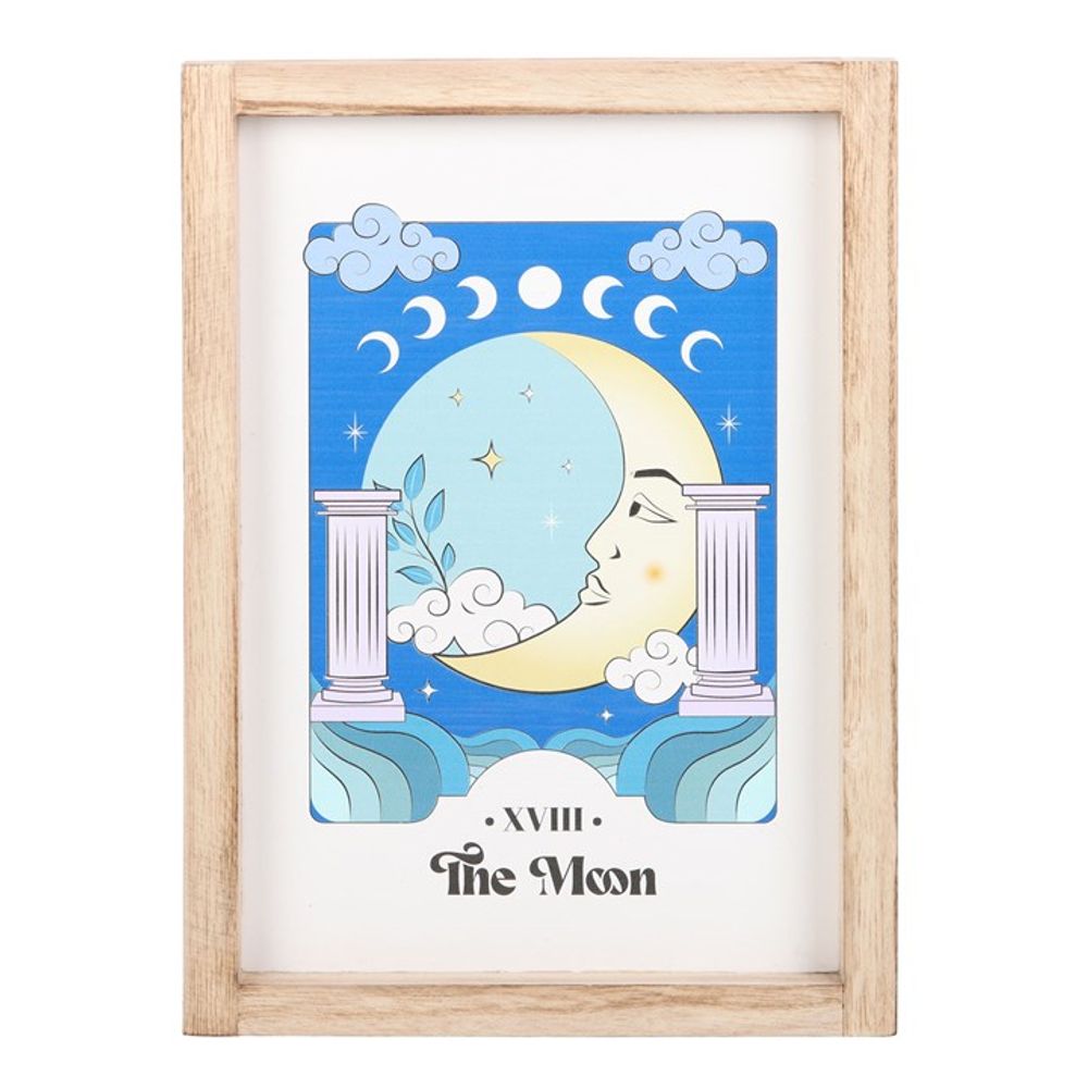 The Moon Celestial Framed Wall Print  This framed art print showcasing 'The Moon' brings a touch of celestial magic to any trendsetter's space, blending mystical vibes with a calming color palette. The serene illustration invites calm, ideal for creating a tranquil corner in the home a bustling young adult's life. Free delivery with Fandomonium