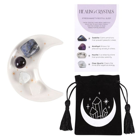 Stress Healing Crystal Set with Moon Trinket Dish  This stunning set of healing crystals comes with four crystal tumblestones to help reduce stress, ease anxiety and promote restful sleep. Includes a crescent moon trinket dish, matching information card and a printed drawstring, making this a meaningful gift for those in need of some extra care. Stones include; sodalite, amethyst, howlite and clear quartz. Free UK delivery by Fandomonium