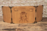 Wooden Battle Axe D20 Design Dungeon Master Screen - Handmade by FandomoniumAn impressive, budget friendly addition to your RPG setup. Featuring Fandomonium's Battle Axe D20 design, the screen's 3 sections fold on hinges and has an antique effect catch for easy storage. The finish is aged and antiqued by hand to give you that rustic, tavern feel. Hand made by Fandomonium