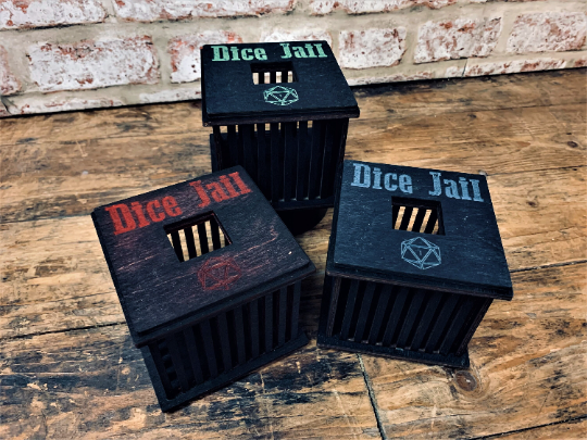 black wooden dice jail with colourful text. Choice of 3 colours. For use with Dungeons and Dragons, D&D, Tabletop Gaming. Dice games and RPG's. Free UK delivery with Fandomonium