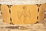 An impressive, budget friendly addition to your RPG setup. Featuring Fandomonium's highly detailed dragon design, the screen's 3 sections fold on hinges and has an antique effect catch for easy storage. The finish is aged and antiqued by hand to give you that rustic, tavern feel. Hand made by Fandomonium